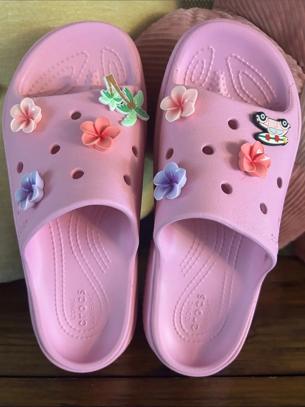 Crocs Pink stomp slides with charms
